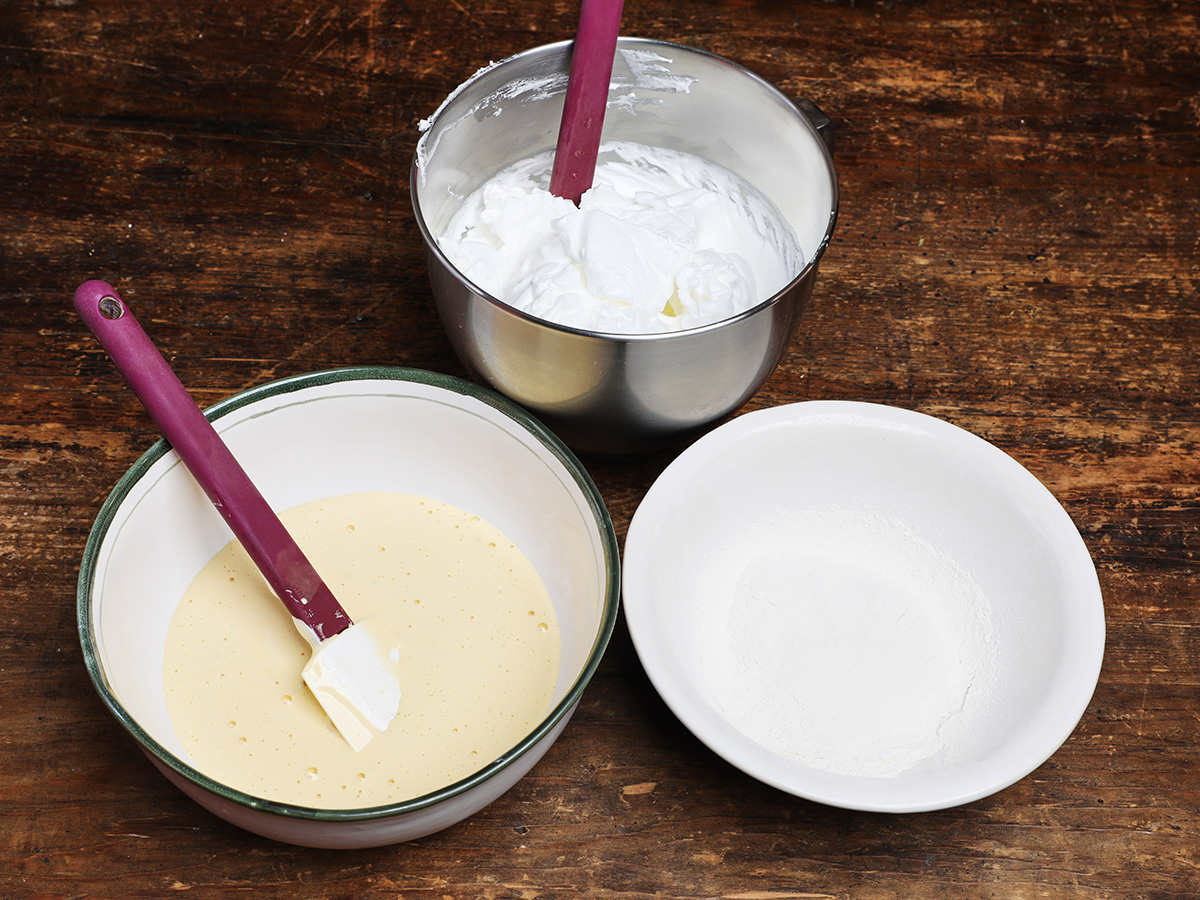 Baking bowls with egg whites, egg yolks and flour