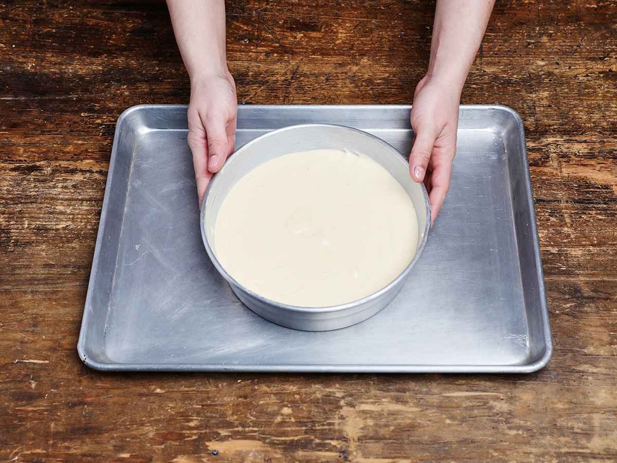 Tres leches cake batter in round cake pan