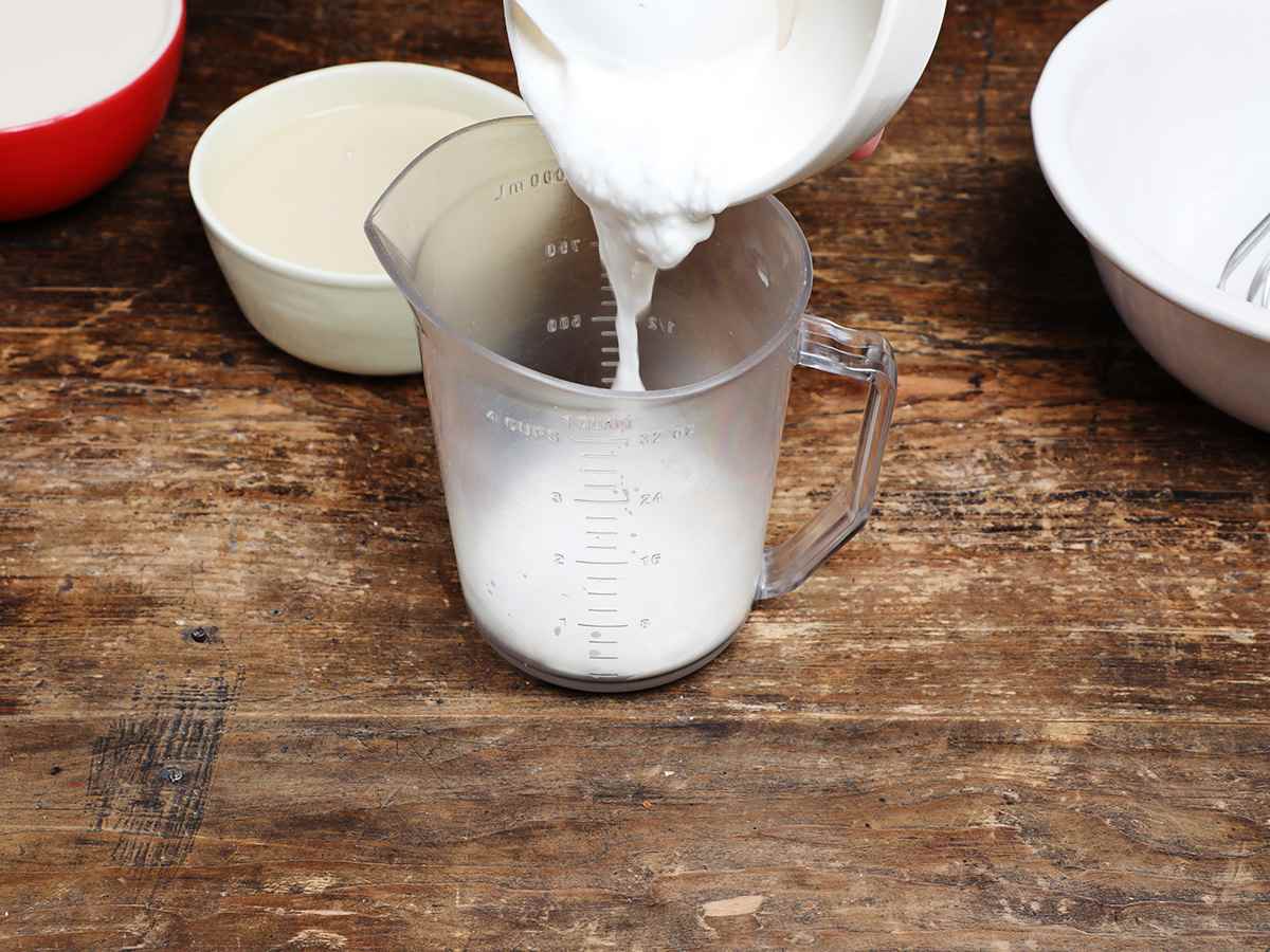 Pouring Cream into Measuring Cup