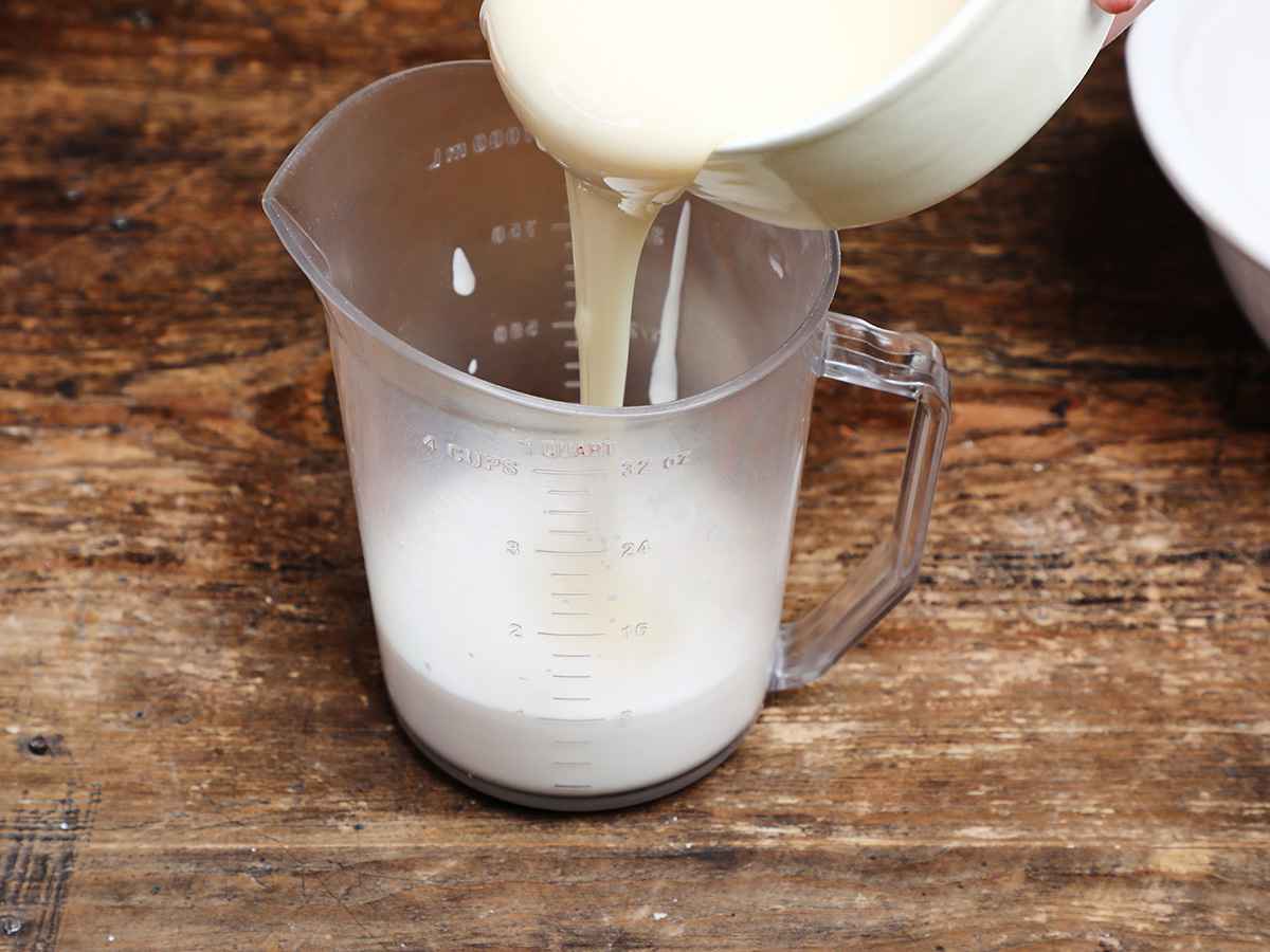 Pouring Condensed Milk into Measuring Cup