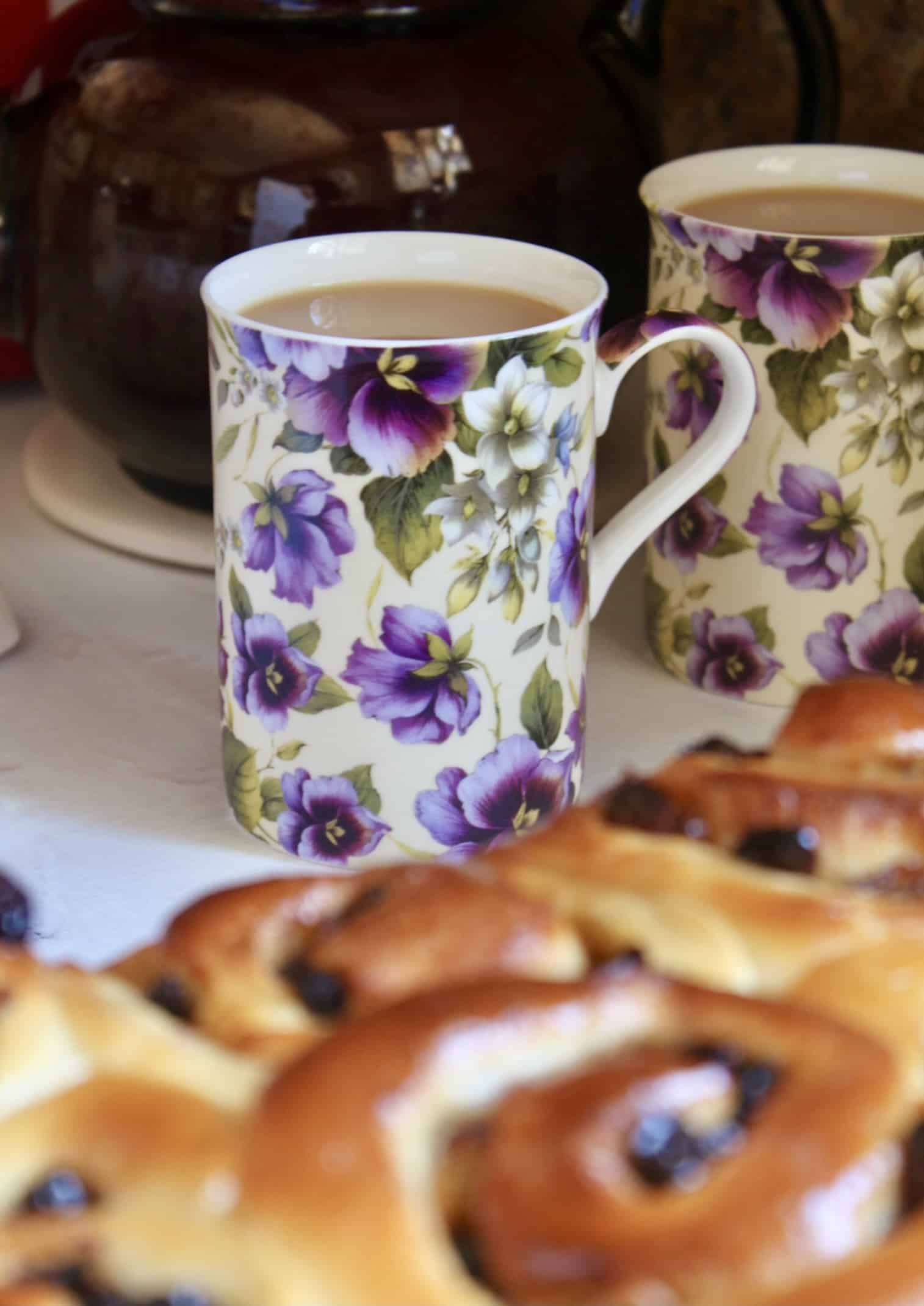 in front is a cup of tea with Chelsea cake