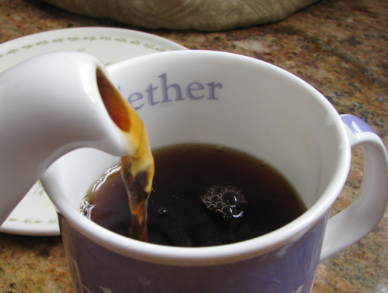 pour black tea into cup