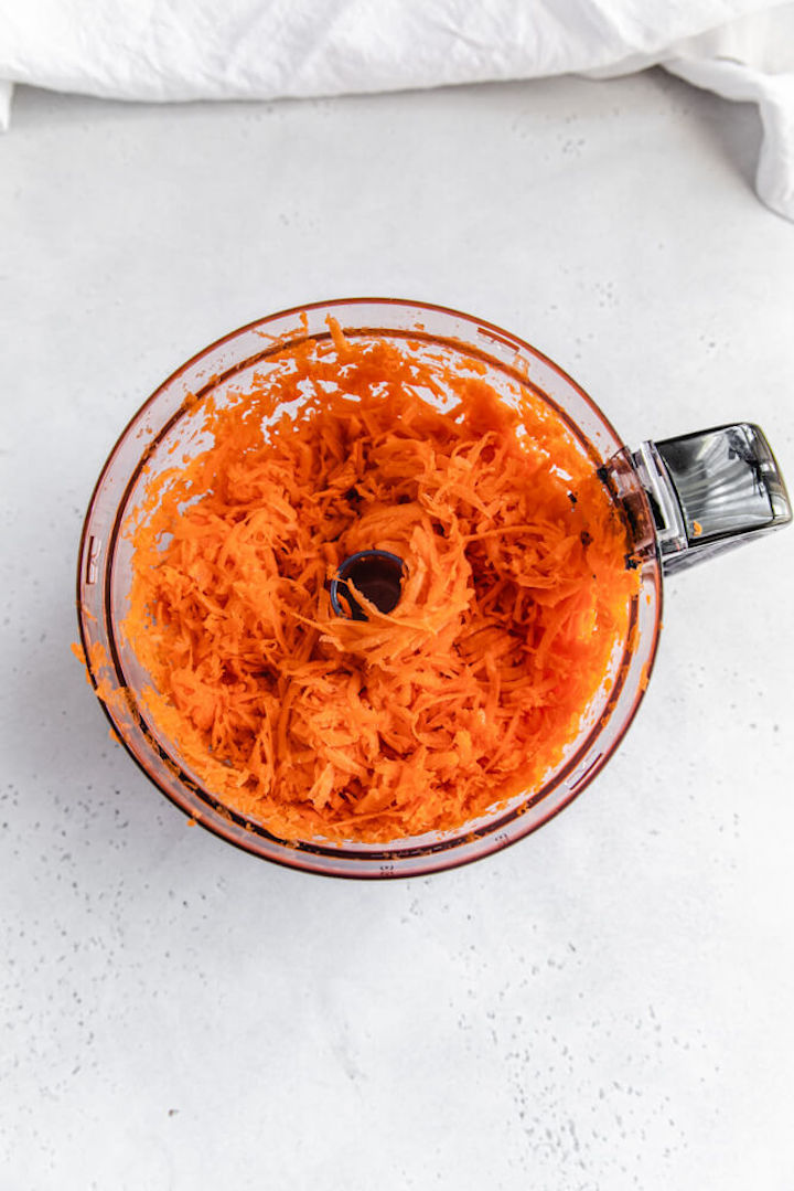 shredded carrots in a food processor