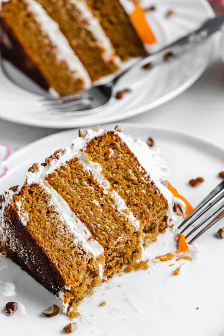 half eaten carrot cake on a plate