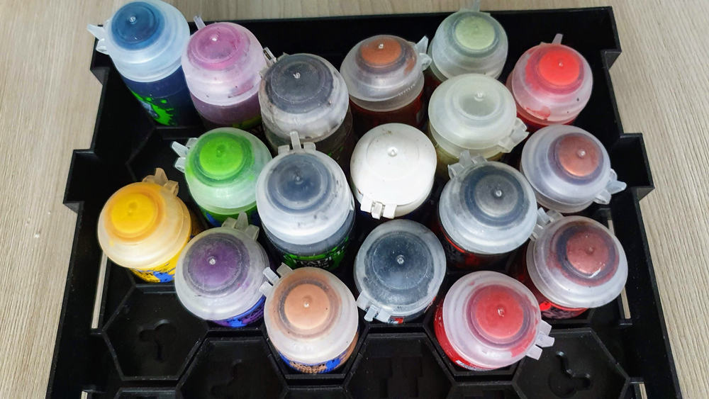 A set of paints for coloring models according to Warhammer 40 000
