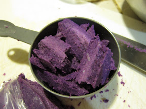 photo of mashed purple sweet potato in a measuring cup