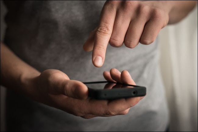 Close-up of a man using a smartphone