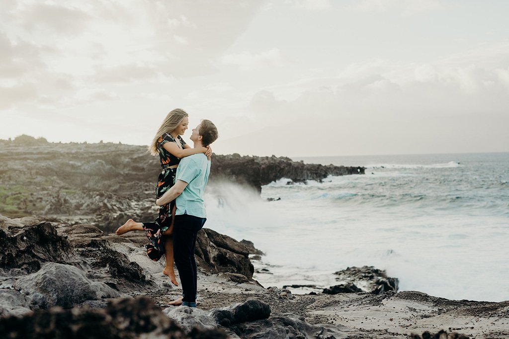 a couple doing their destination engagement photos at the beach