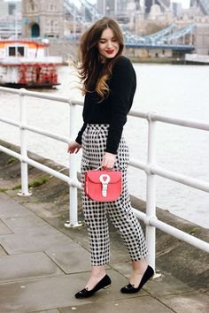 black sweater plaid pants red wallet