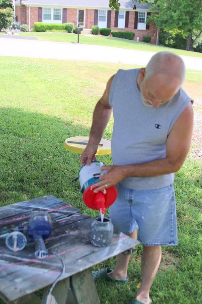 Pour paint into the paint sprayer