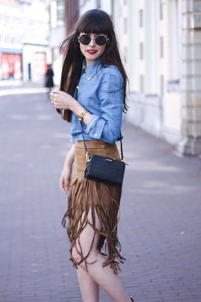 chambray blue shirt with green suede tassel skirt