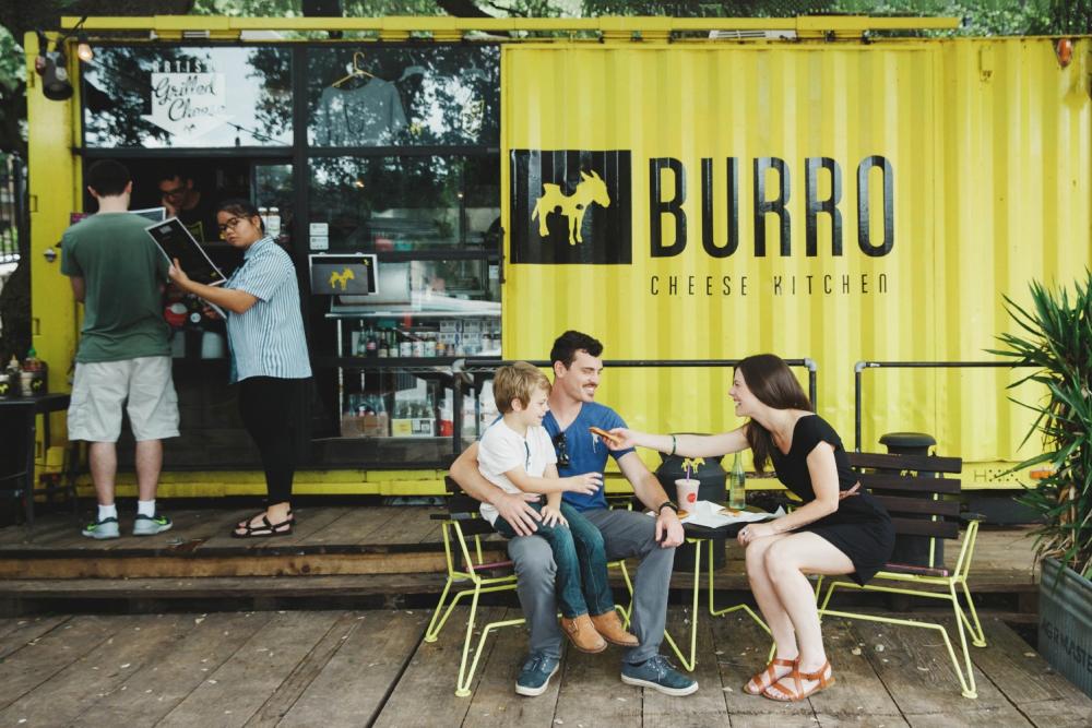 Couple with kid outside Burro Food Truck in Austin Texas