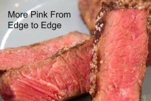 Beef steak cooked medium, rare edge to edge.