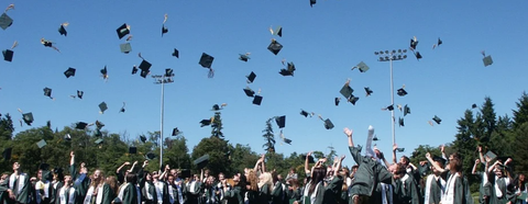 Graduation cap in the air