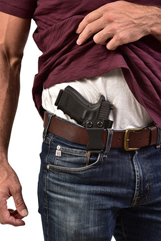 man hiding holster