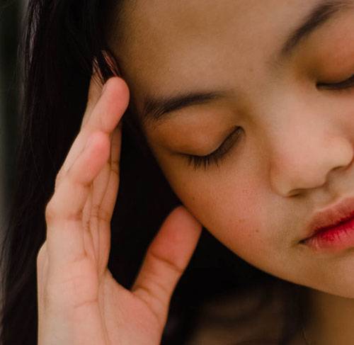 woman with eyes closed