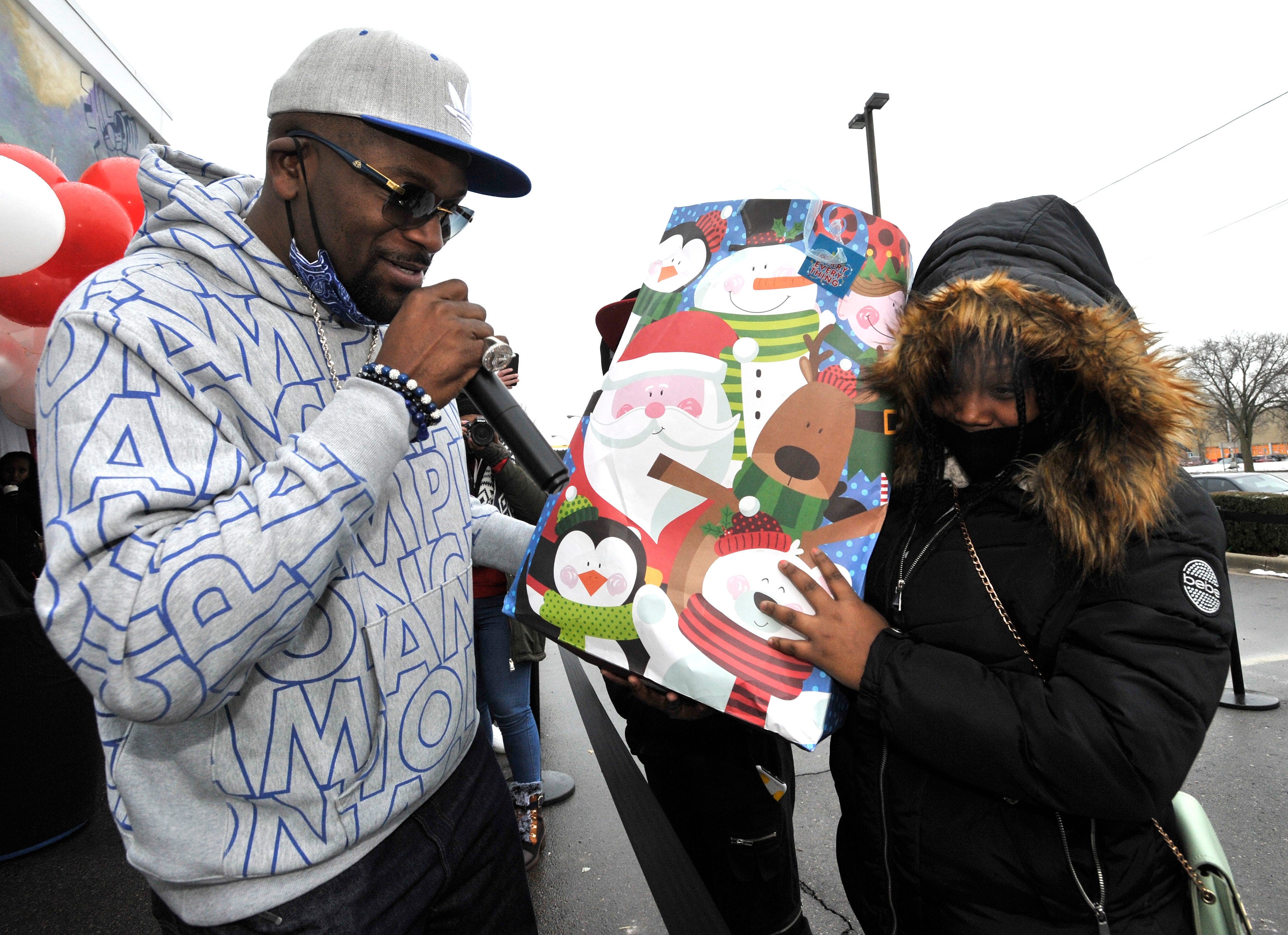 Trick Trick, aka Christian Mathis, works with Detroit Phoenix Center founder and CEO Courtney Smith and others as they hand out gifts in December 2020 at a DPC event to help out homeless or living in poverty. The hip-hop artist will narrate his own story for the FX series