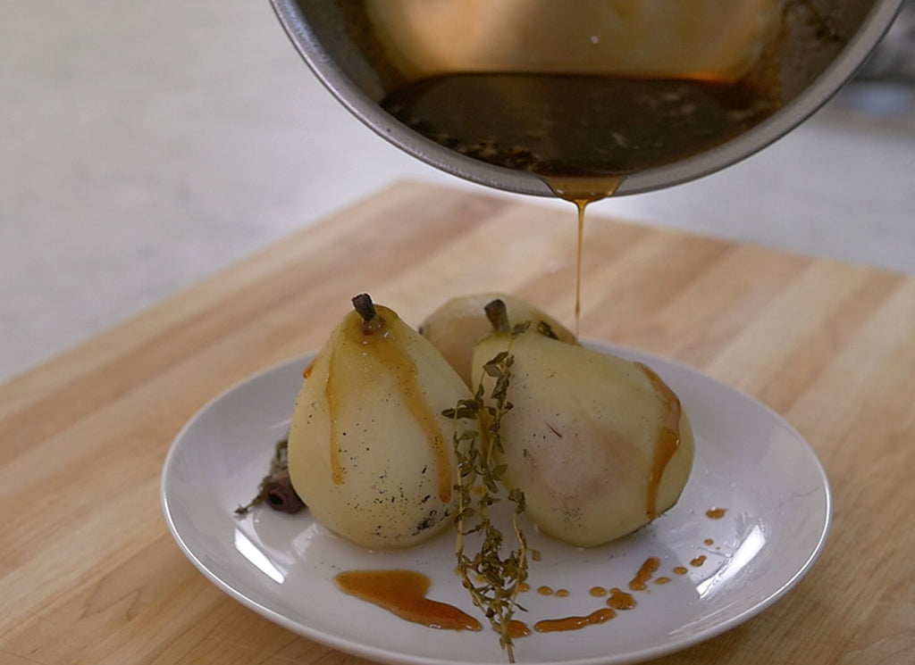 What is a pan: Poaching liquid poured from a pan onto a pear