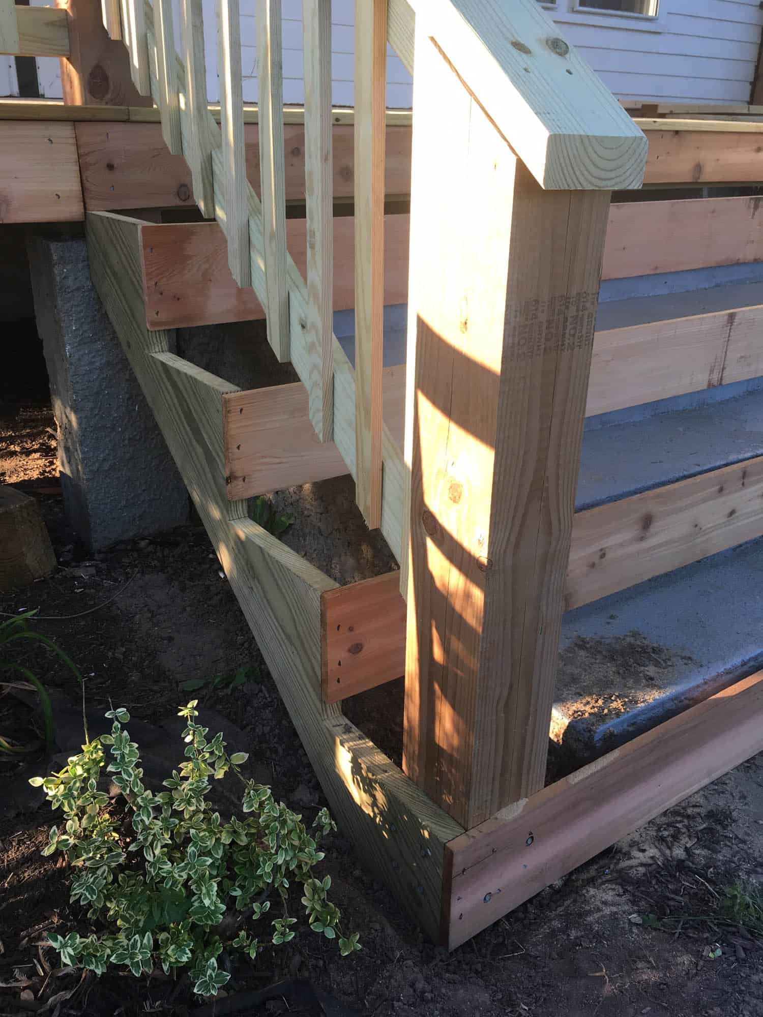 how to sheathe concrete stairs in front of a wooden porch