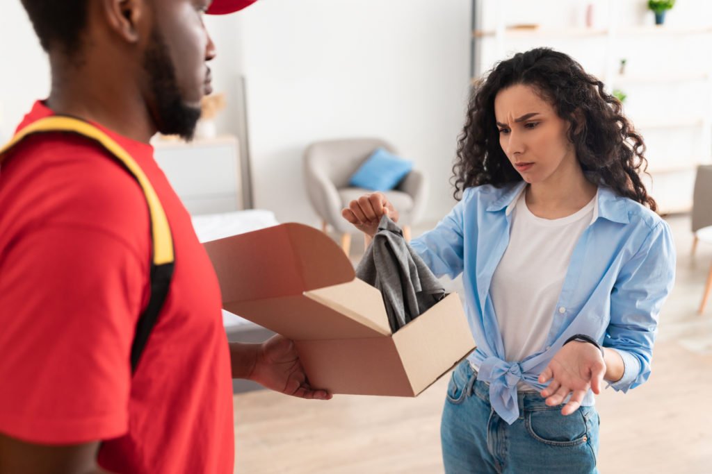 Confused woman disappointed about a delivery package