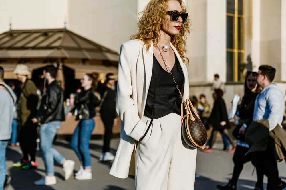 Fashion consultant Elina Halimi wears a Louis Vuitton bag