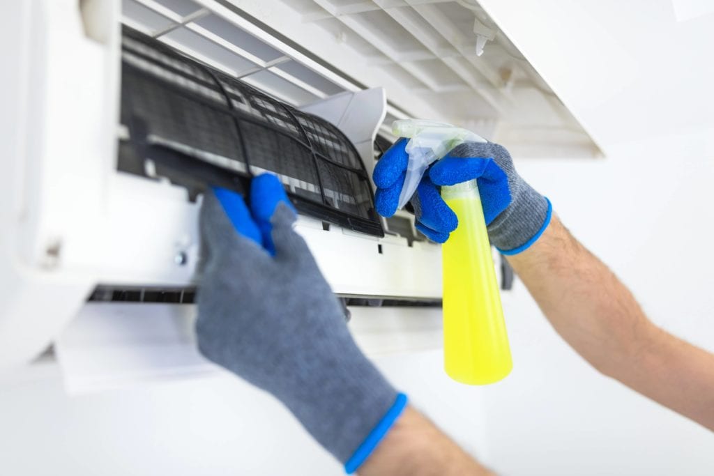 Vacuum and spray the internal components to clean the Window Air Conditioner without taking it apart