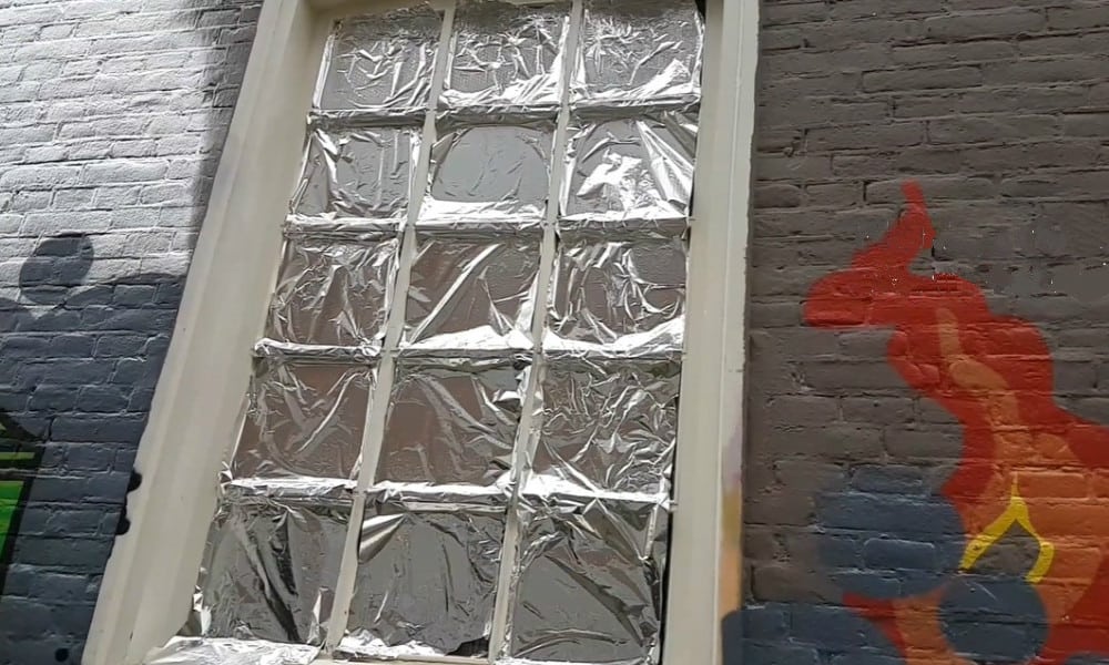 Cover your windows with aluminum foil