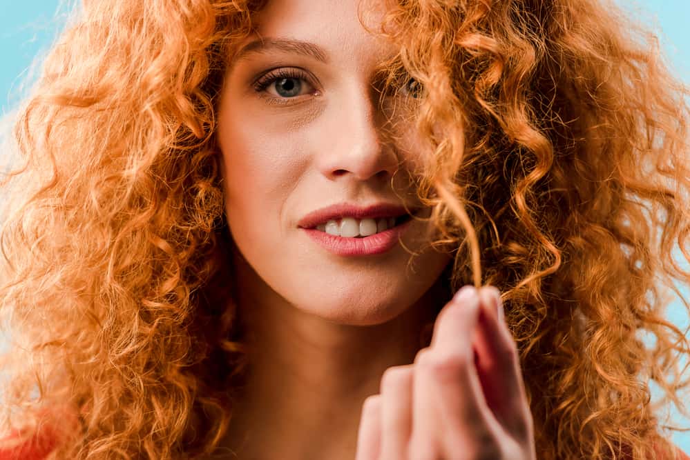 Close-up of Caucasian female with 2c wavy hair carrying the red foreskin gene.