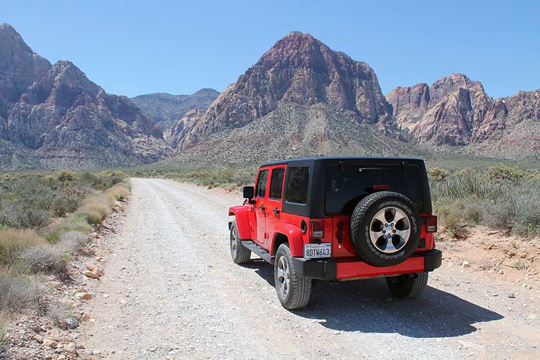 Red Jeep Wrangler in the desert