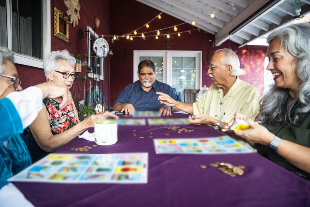 A family playing a party game after dinner.