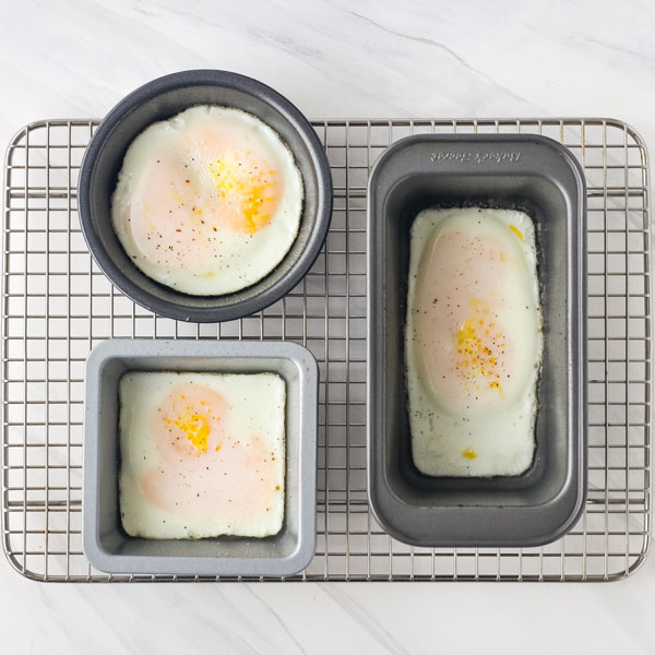 Bake eggs in small round pan, square pan, and mini muffin pan on a baking rack.