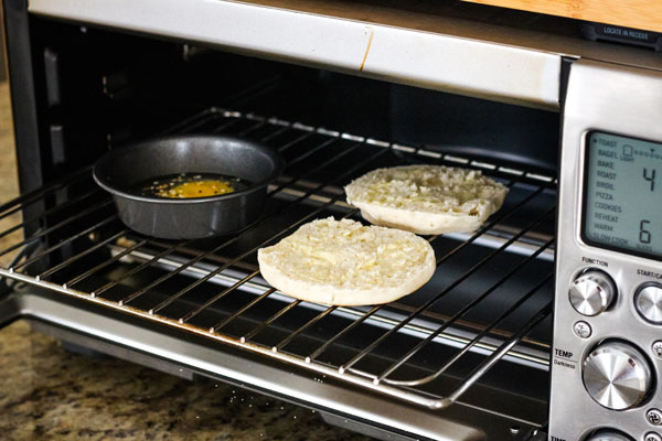 A small baking pan and English muffin inside the Breville Smart Oven Pro.