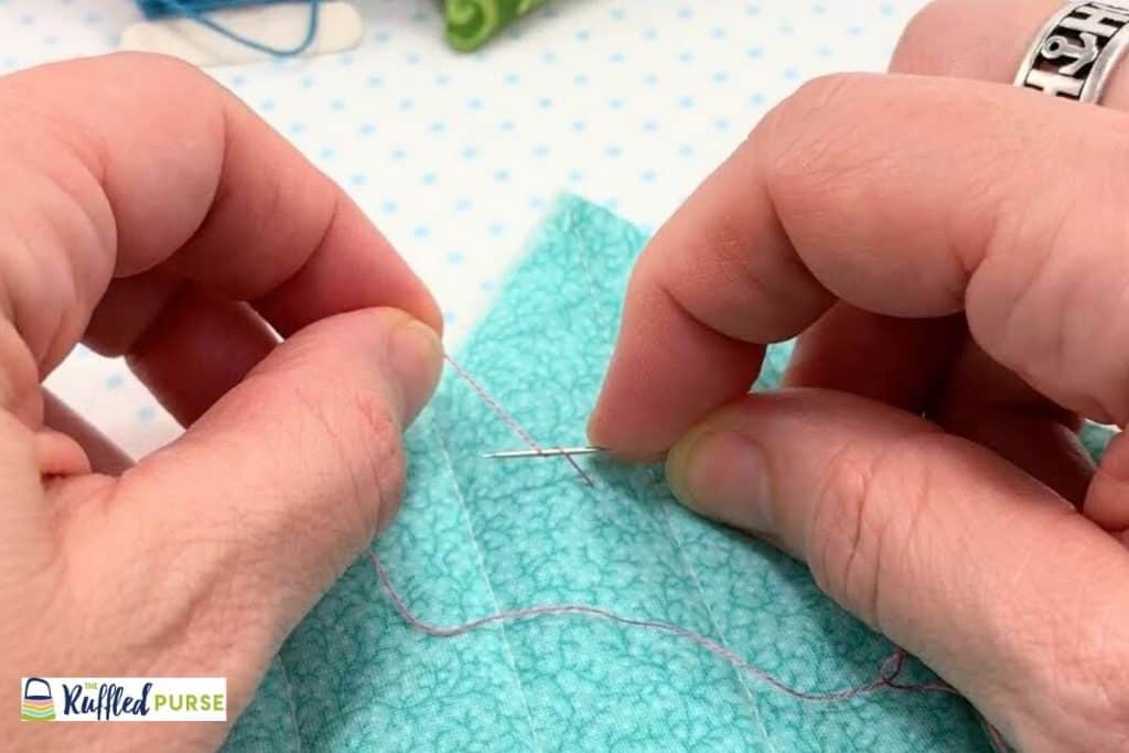 Wrap thread around needle twice.