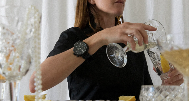 women pouring wine and wearing boyfriend watches