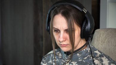 Woman frustrated while wearing headphones (From: Unsplash)