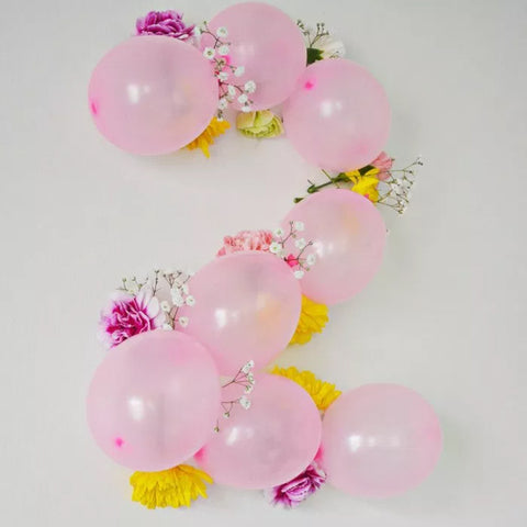 Light pink balloons made into shape