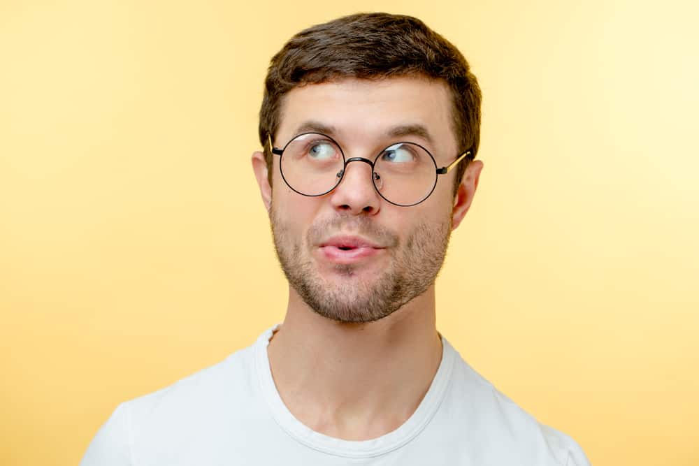 man in glasses whistling