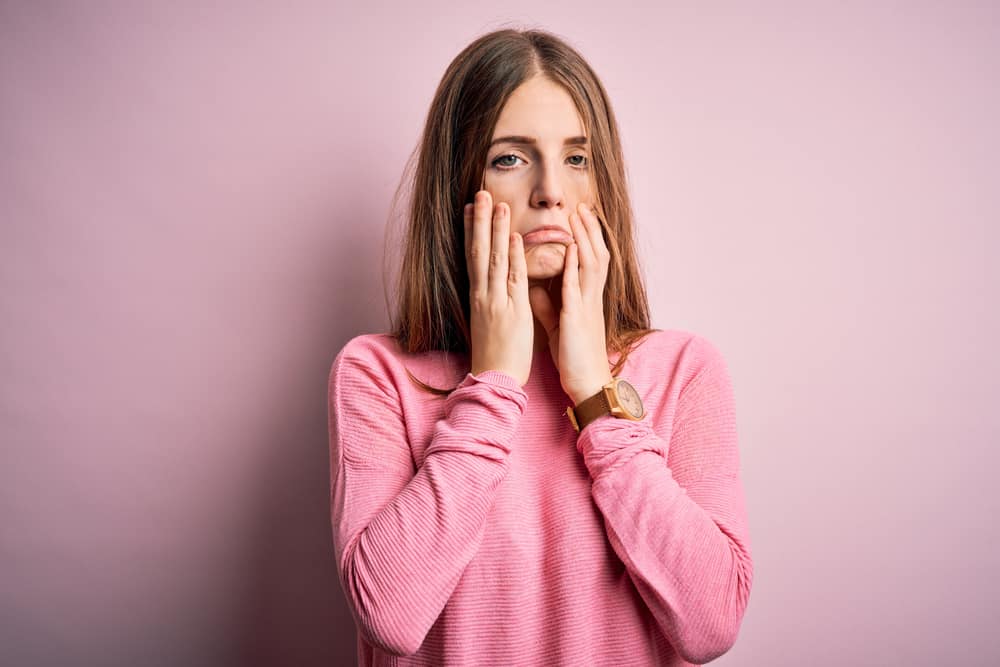 hands covering face, depression and sadness, upset and irritated