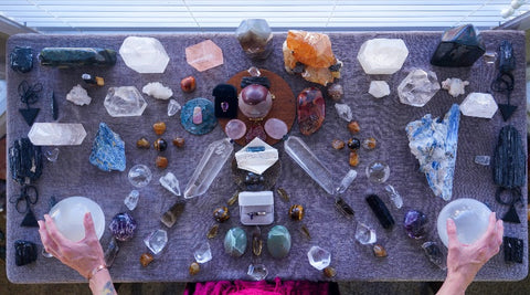 Crystal on Altar with hand holding Selenite Balls