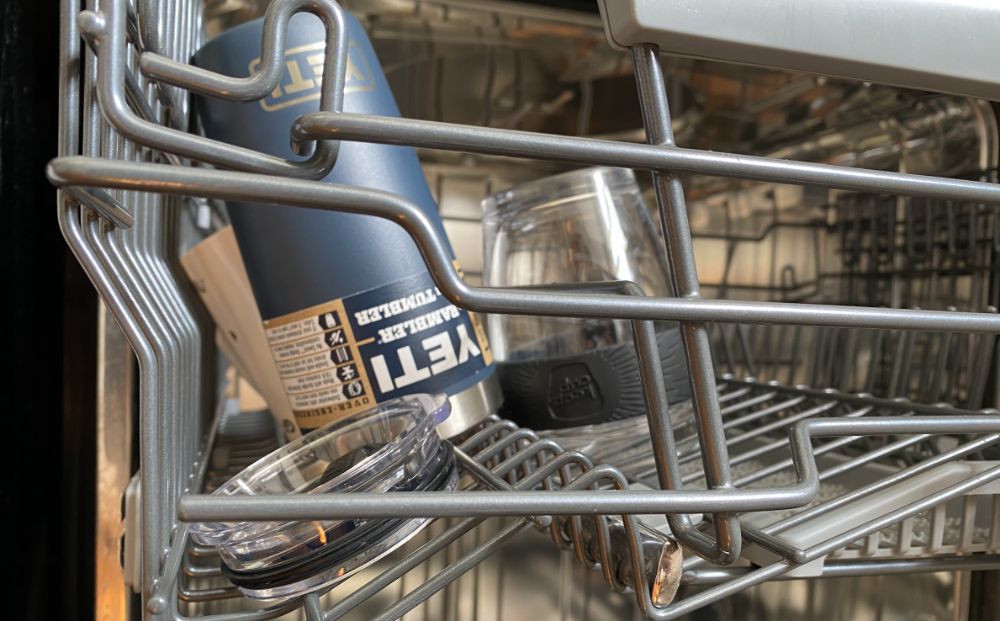 yeti mugs in the top shelf of the dishwasher