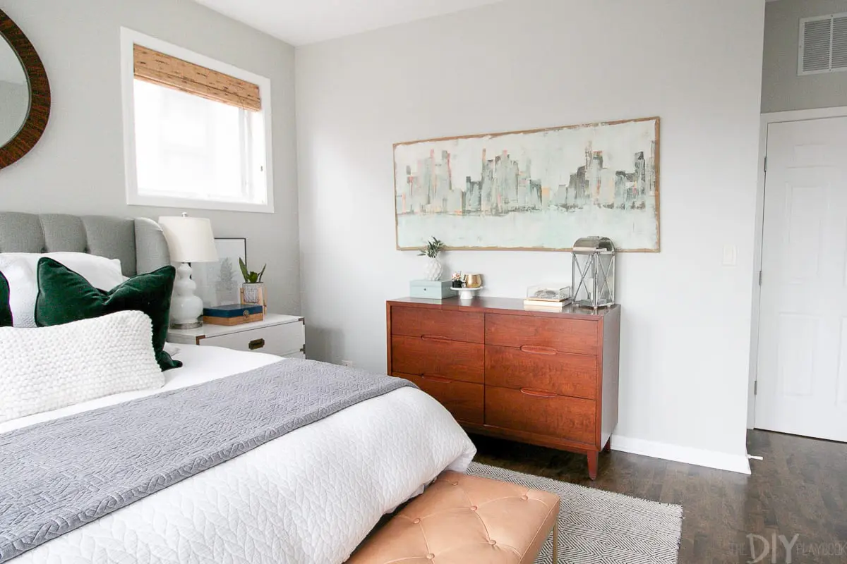 Tips for fixing a tilted mirror to the wall in your master bedroom space.