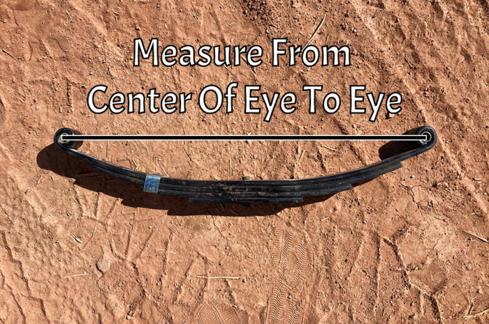 For a double eye leaf spring measure from the center of one eye to the other.