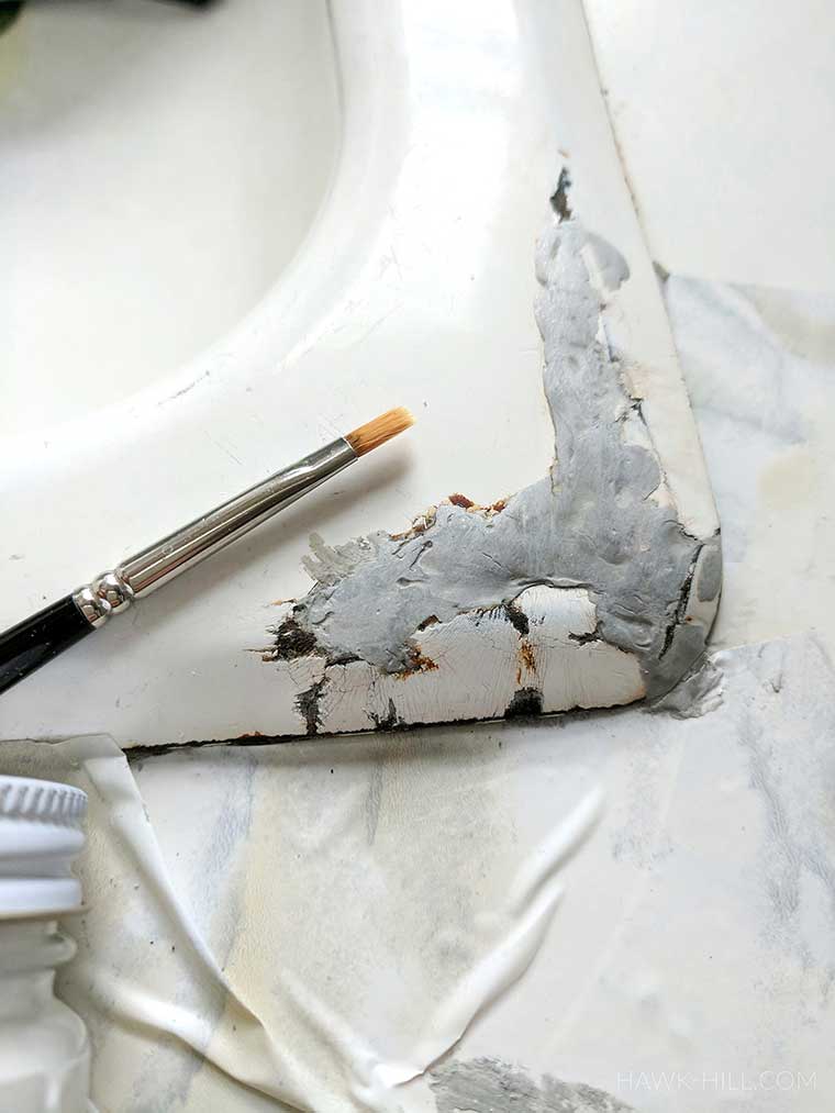 Carefully paint over the tub or sink, onto the patched part