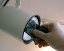 Remove light bulbs in wall sockets with duct tape