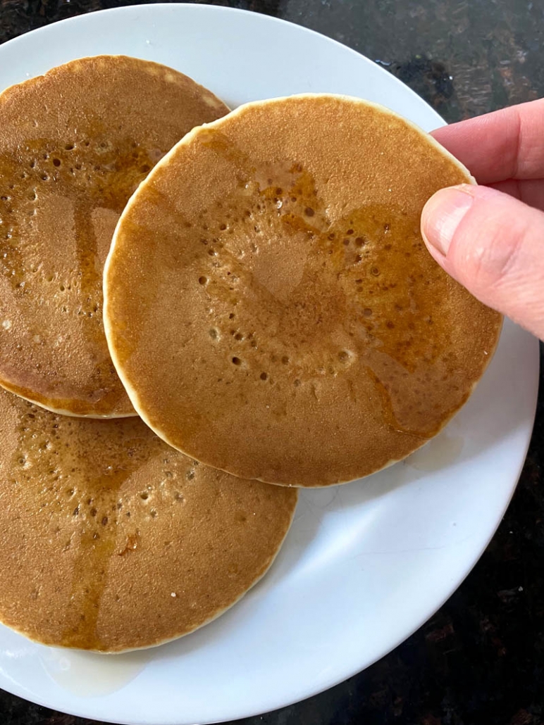 Frozen pancakes are reheated in an air fryer