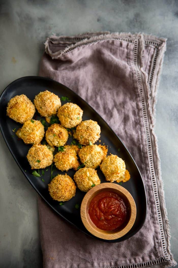 risotto balls on a rye bread with sauce on the side