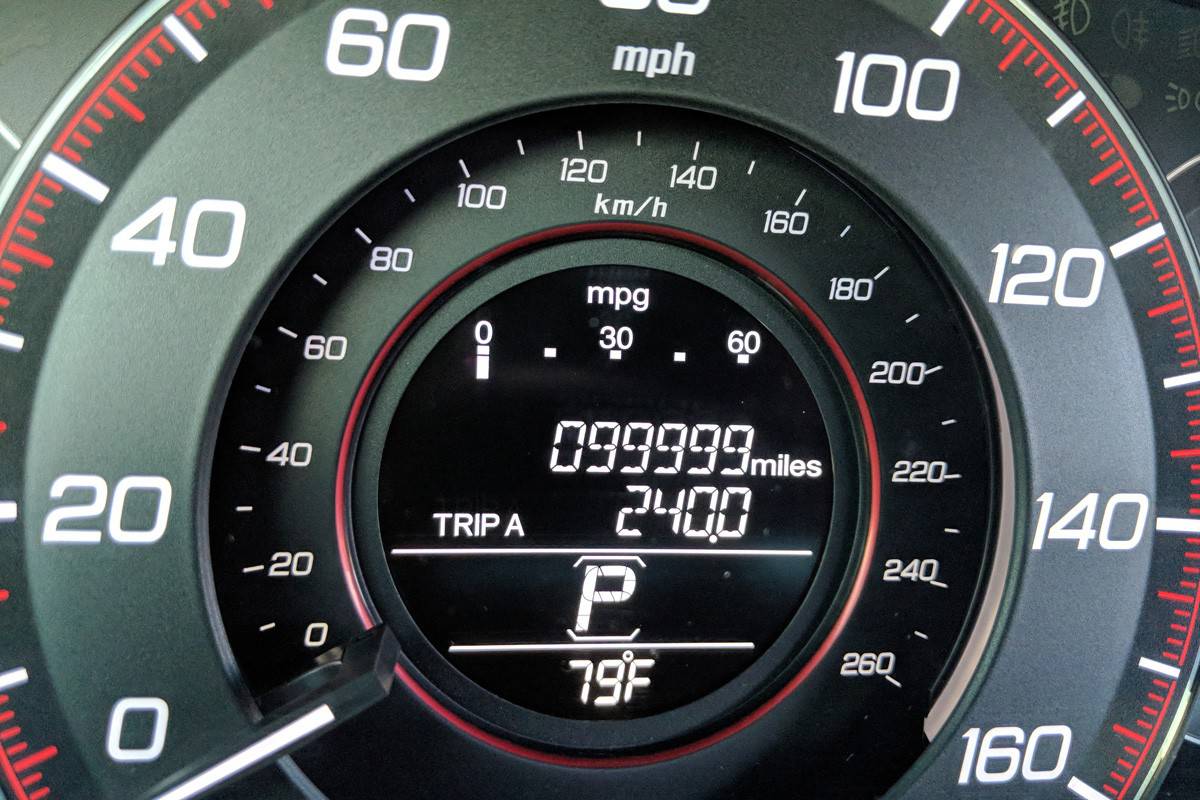 The tachometer shows 99999 miles on its odometer