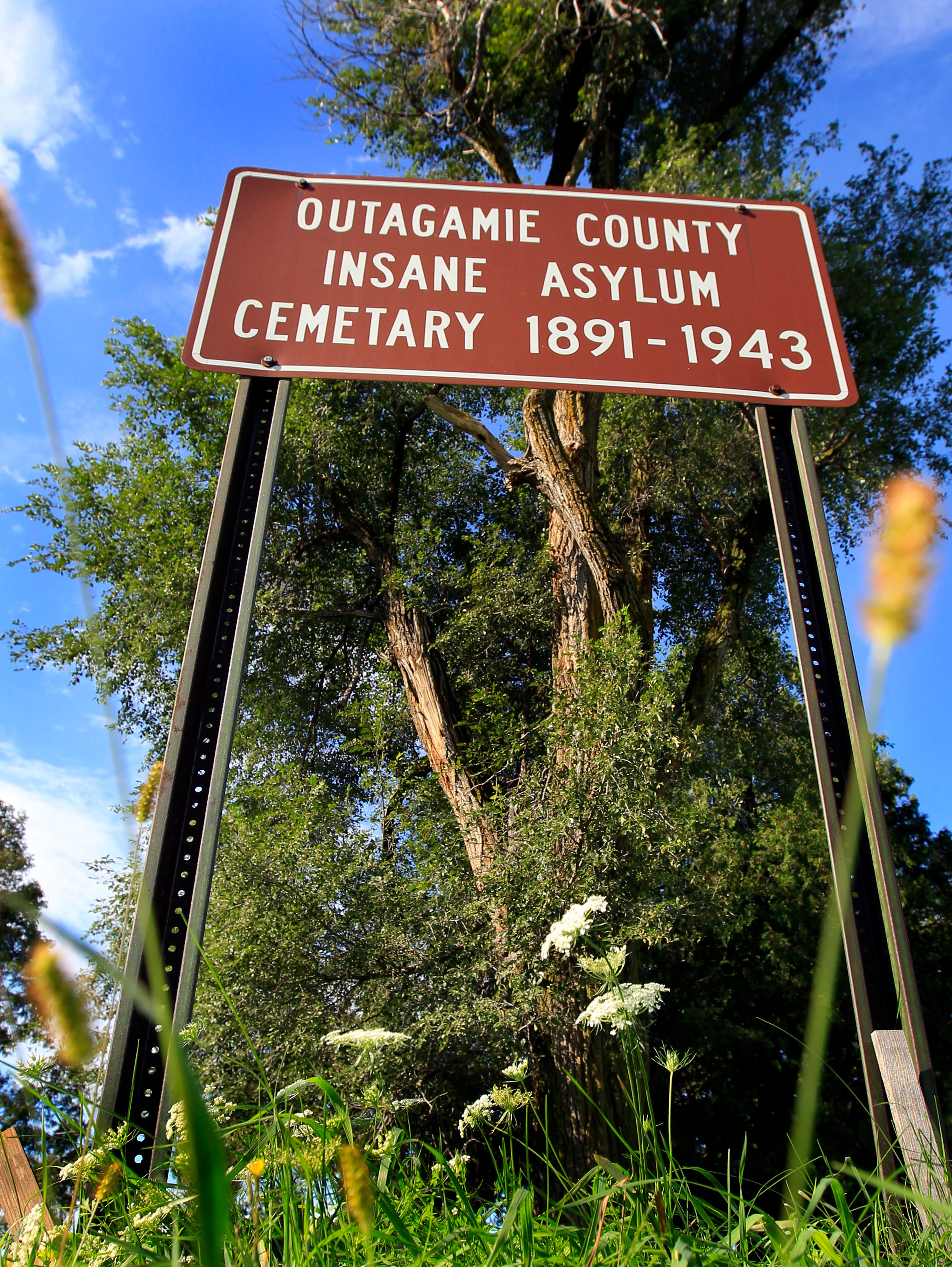 A sign marks the former Outagamie County Asylum Cemetery in Grand Chute.