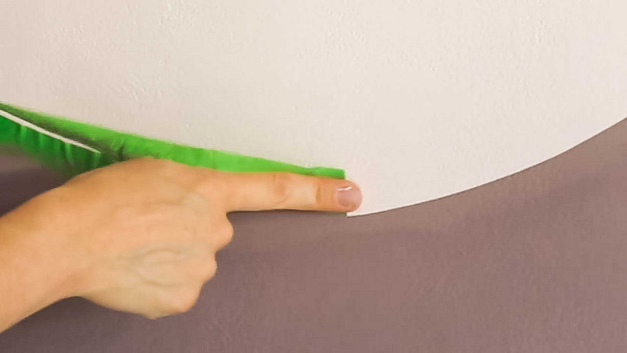the best way to remove masking tape from painted wall without damaging the paint too much
