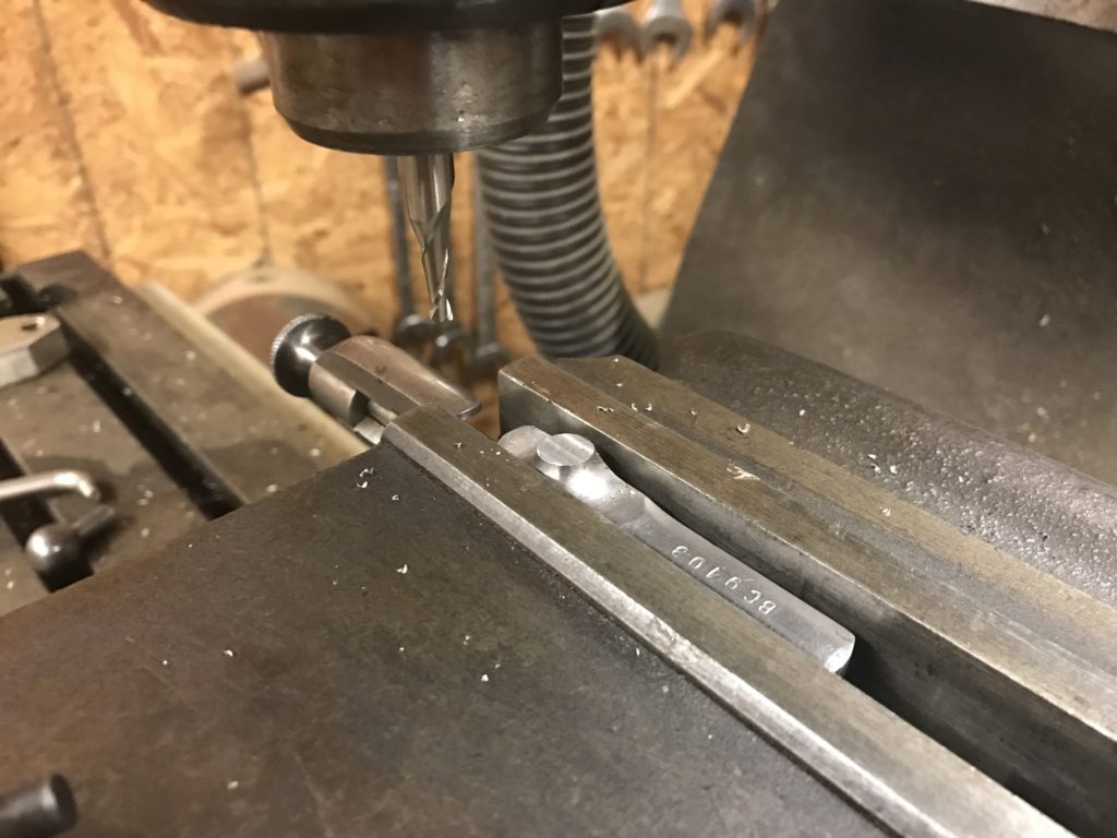 Flat machining of the rough cross-section of the bolt